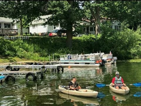 Photo of father and son kayaking